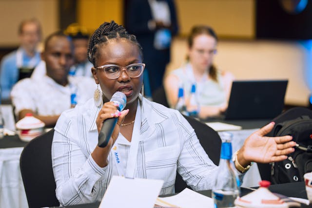 A woman speaking at a conference